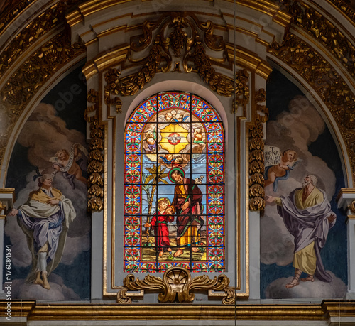 Stained glass window and fresco paintings in St Pauls cathedral in the city Mdina, Malta.