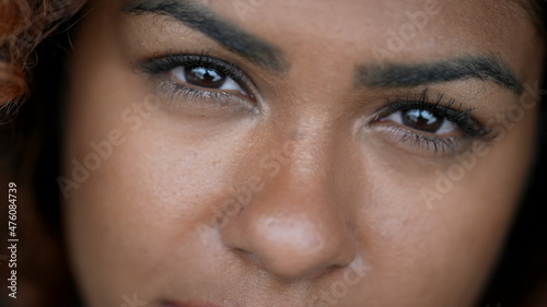 Hispanic black woman macro eyes close-up face looking at camera