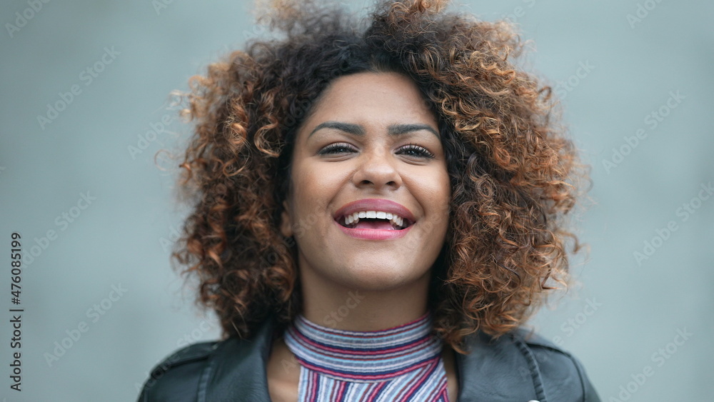 Happy Brazilian woman close-up face looking at sky contemplating Happy Brazilian woman close-up face looking at sky contemplating