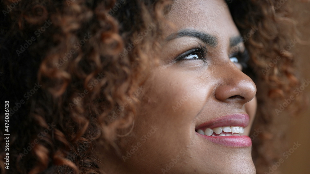 Black woman opening eyes smiling close-up face portrait Black woman opening eyes smiling close-up face portrait