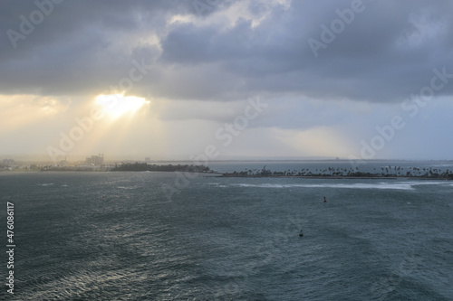 Stormy ocean with cloudy sky with island in the background, view from Castillo San Felipe del Morro, Puerto Rico