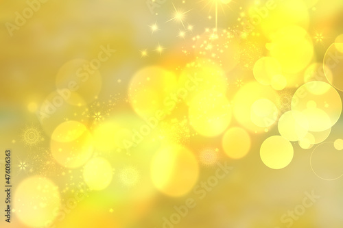 A festive abstract delicate Happy New Year or Christmas background texture with colorful gold yellow pink blurred bokeh lights and stars. Space for design. Card concept or advertising.
