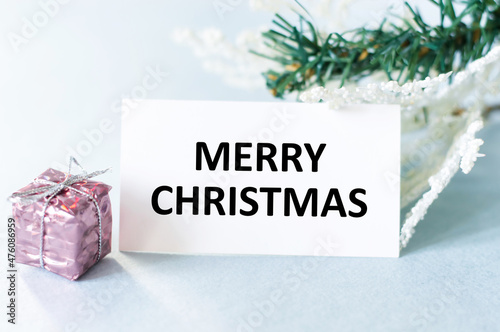 Merry Christmas card inscription on a light background, holiday card