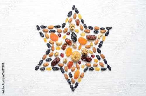 Mix of dried fruits and nuts - symbols of judaic holiday Tu Bishvat. Star of David .
