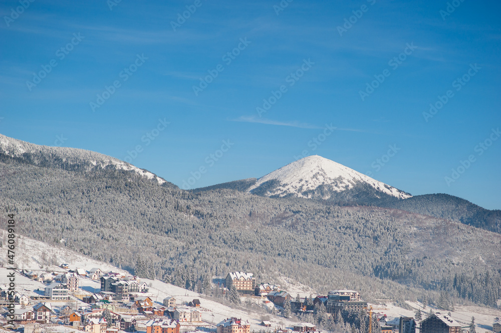 ski resort in the mountains with blue sky and snow