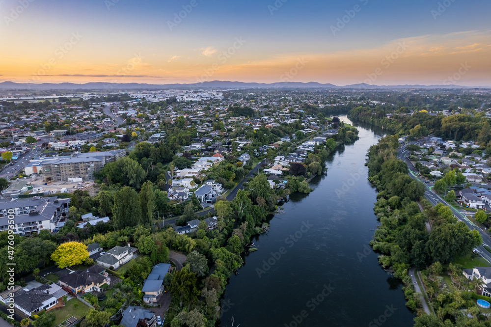 Aerial drone view, looking North down the Waikato River, over the city of Hamilton (Kirikiriroa) in the Waikato region of New Zealand.