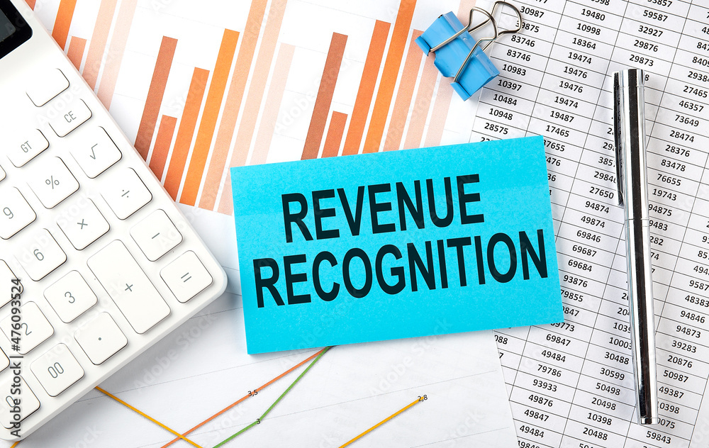 REVENUE RECOGNITION text on the sticker on diagram background REVENUE RECOGNITION text on the sticker on diagram background