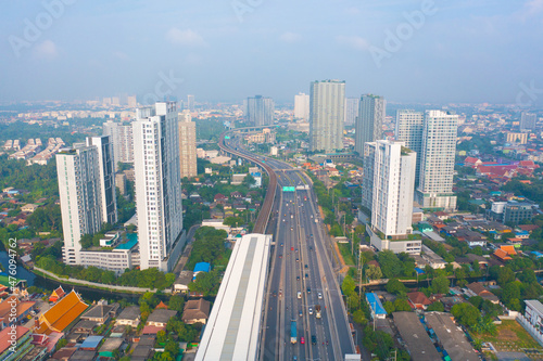 Aerial view of highway street road at Bangkok Downtown Skyline, Thailand. Financial district and business centers in smart urban city in Asia.Skyscraper and high-rise buildings at sunset © tampatra