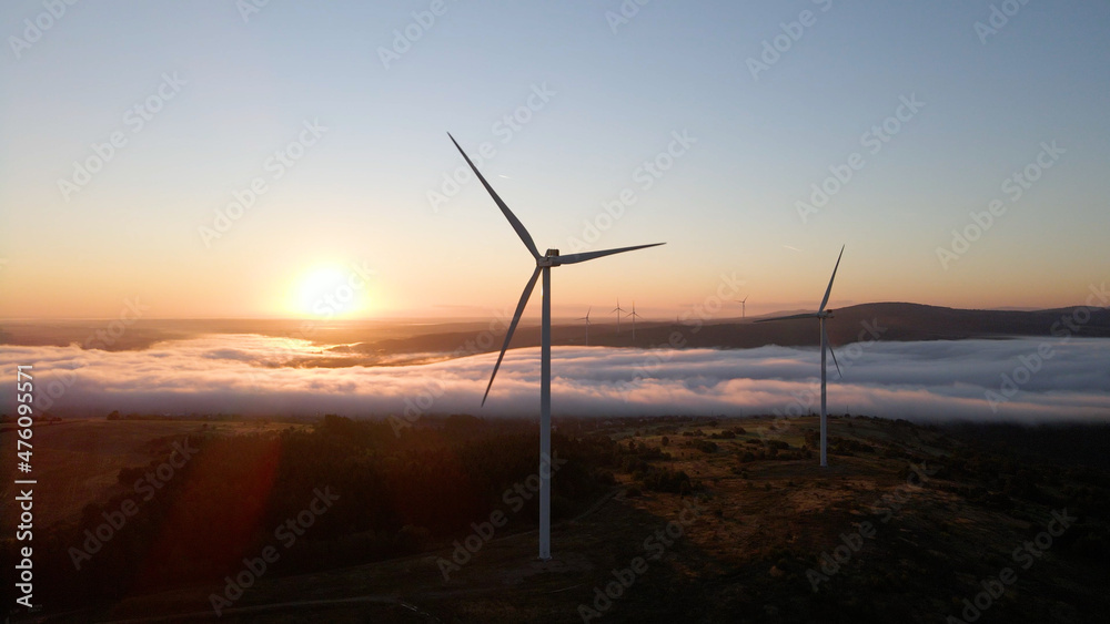 Obraz premium Wind power plant at sunrise. Aerial photography