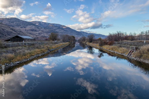 river reflecting clouds in the mountains in the Okanagan Valley, BC