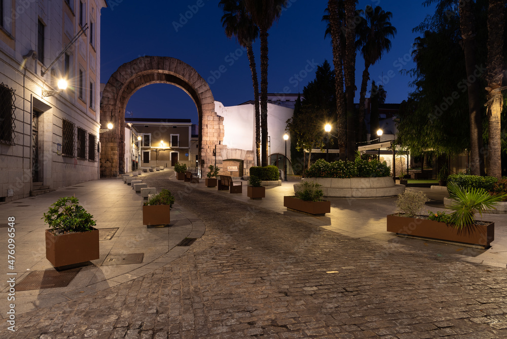 Night view of the streets of Merida with the Arch of Trajan in the background, part of the Archaeological Ensemble, UNESCO World Heritage Site, Extremadura, Spain