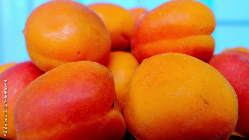 juicy orange peaches with velvet peels rotate on a turntable, beautiful fruit texture, healthy food concept, ingredient for making jam, marmalade, juice, healthy fruit smoothie juicy orange peaches with velvet peels rotate on a turntable, beautiful fruit texture, healthy food concept, ingredient for making jam, marmalade, juice, healthy fruit smoothie