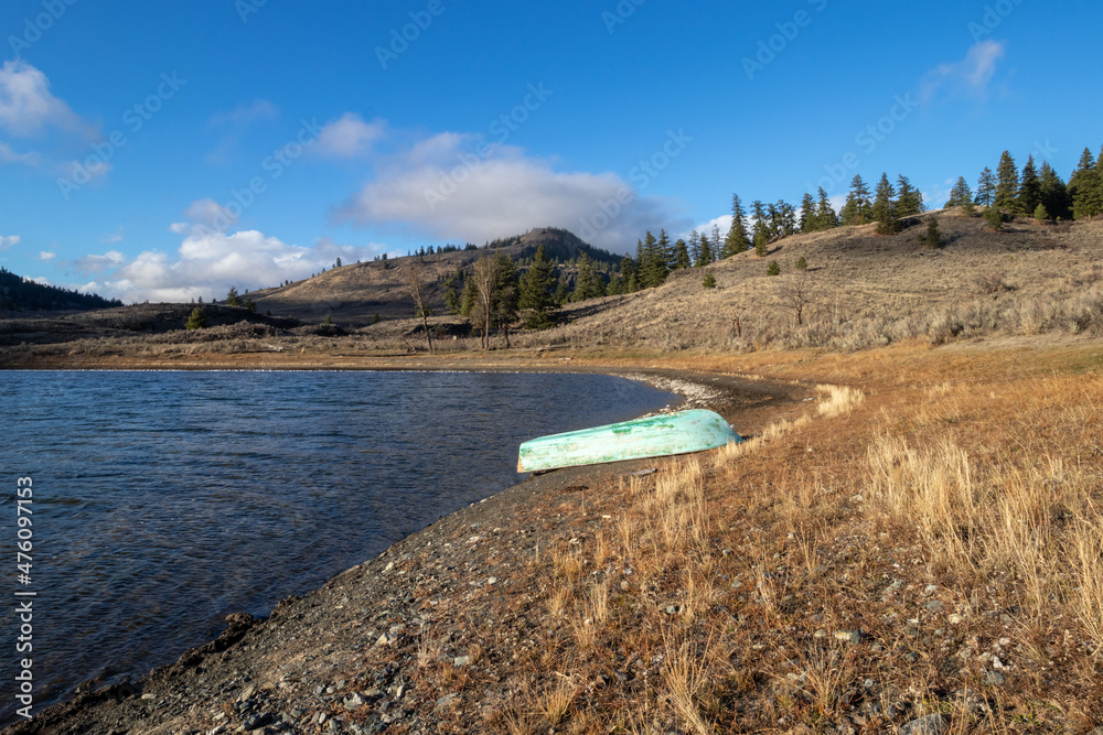 A boat on the shore of Kipoola Lake in BC, Canada