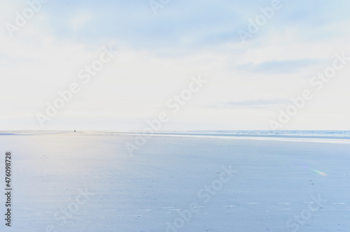 Calm sea panorama  in the distance the figure of a man