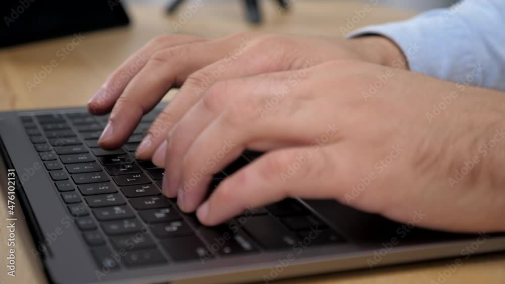 Close up hands man stock trader broker businessman typing on laptop keyboard in office. Salesman works using computer online chatting with investor stock exchange, sitting on chair at desk at home Close up hands man stock trader broker businessman typing on laptop keyboard in office. Salesman works using computer online chatting with investor stock exchange, sitting on chair at desk at home