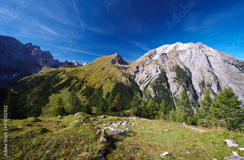 Sommerstimmung in der Morgensonne im Karwendelgebirge in den österreichischen Alpen mit Blick auf das Gamsjoch Berg, dem Hohloch und den Laliderer Wänden im Hintergrund photo