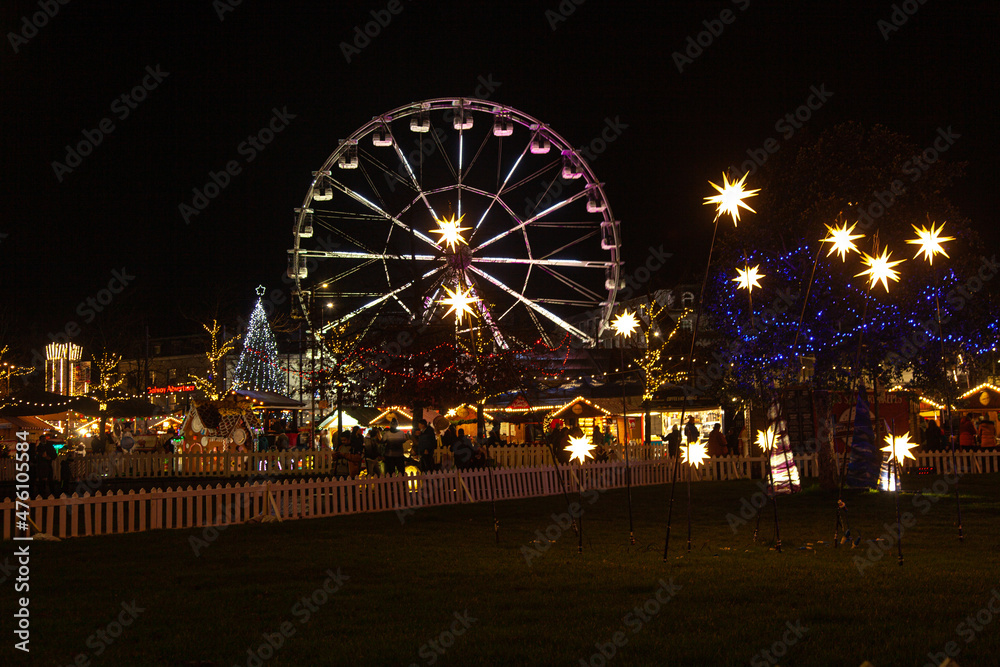 Christmas market with ferris wheel in the night in Galway