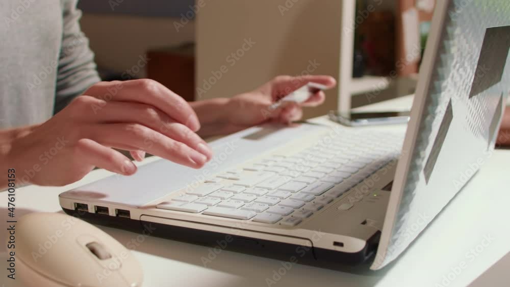 Internet transactions. Woman making online payment with credit card and laptop, paying via internet Internet transactions. Woman making online payment with credit card and laptop, paying via internet