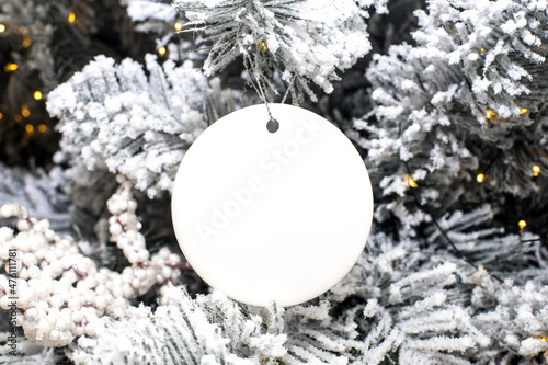 Blank Round Christmas Ornament Mockup over Christmas tree background