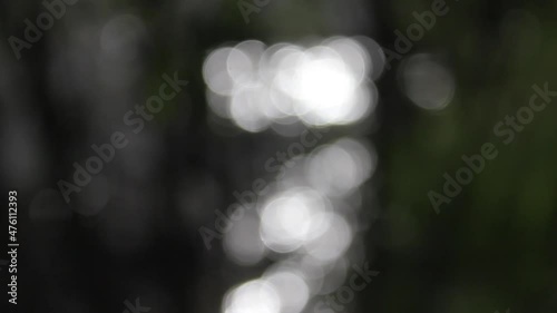 glare on water, bokeh, natural background, lake surface