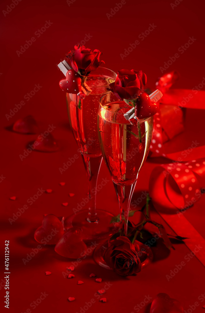 Valentines day red background with two champagne glasses, hearts and scarlet roses, copy space Valentines day red background with two champagne glasses, hearts and scarlet roses, copy space