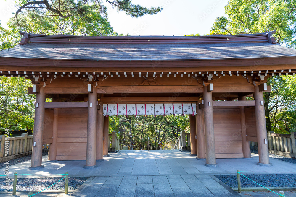 a gate of inage sengen shinto shrine surrounded by pine trees in autumn