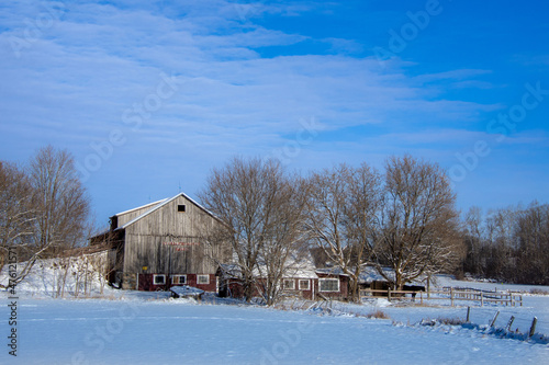 A winter countryside landscape with farm in the province of Quebec, Canada © Gilles Rivest