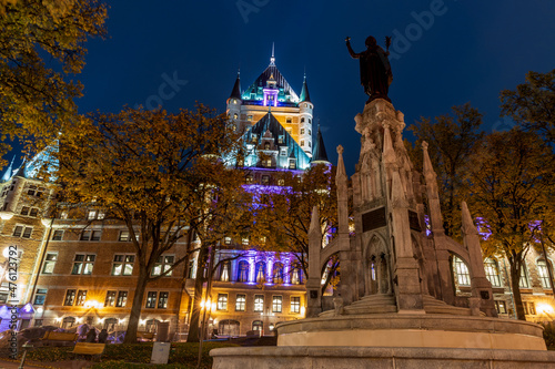 Night view of the Quebec City Old Town in autumn. Place d'Armes, landscaped plaza with a fountain.