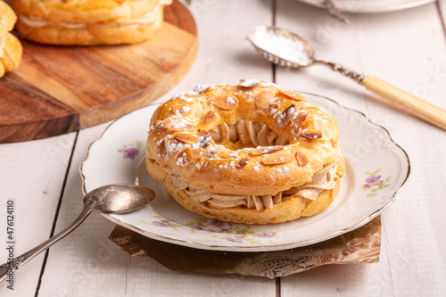 Small pastry Paris Brest in an old plate