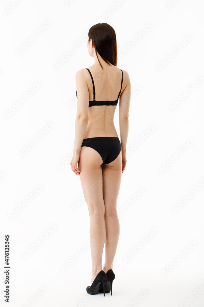 Model tests. Snap Models back view, Beautiful brunette woman in underwear, isolated on white.