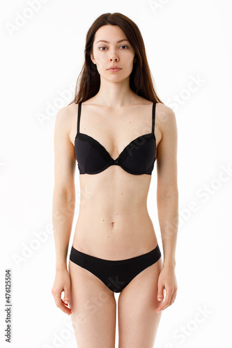Model tests. Snap Models back view, Beautiful brunette woman in underwear, isolated on white.