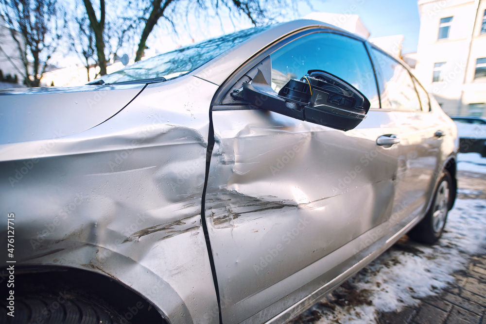 Car body side damage, traffic accident in winter season. Car door damage, broken and damaged side mirror on car door. Car body side damage, traffic accident in winter season. Car door damage, broken and damaged side mirror on car door.
