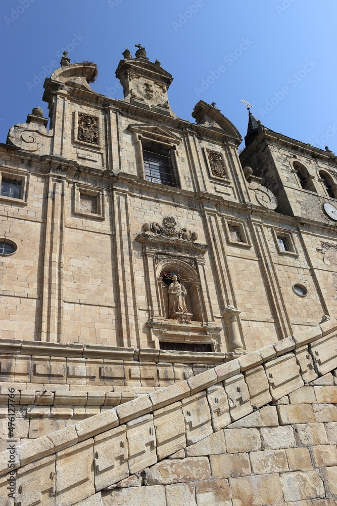Stone facade and staircase of the Church of San Nicolás el Real, in Villafranca del Bierzo, León, Spain. Vertical image.