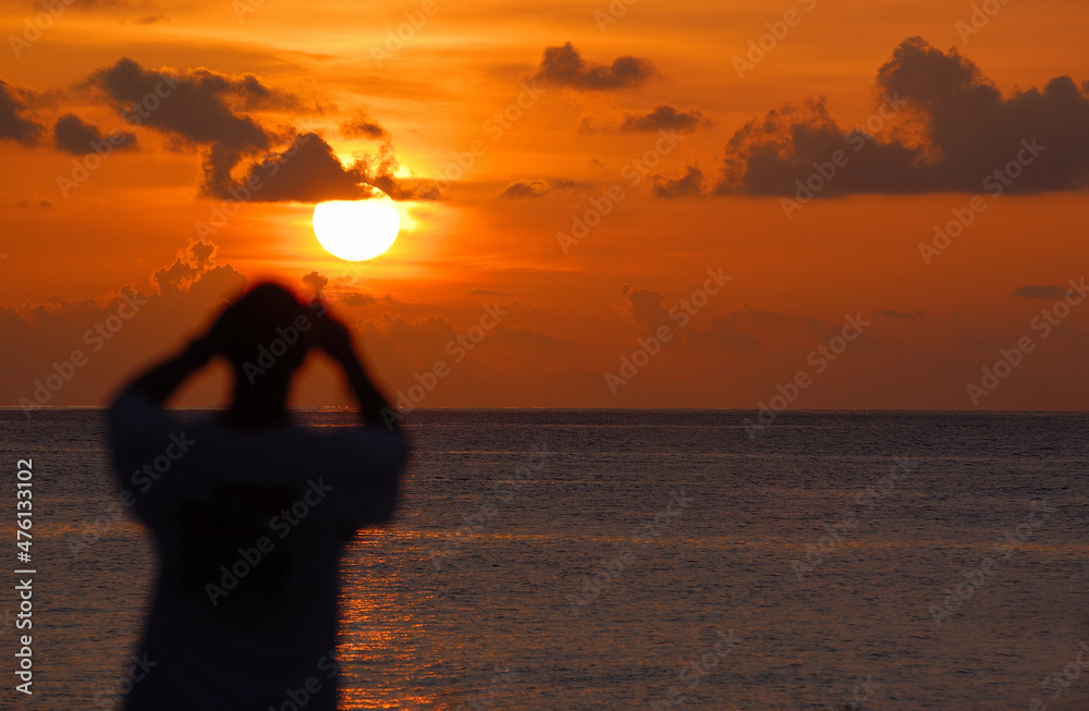 Viewing tropical sunset.