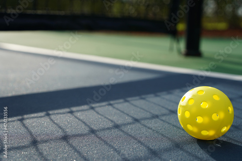 Close up of a pickleball on pickleball court. photo