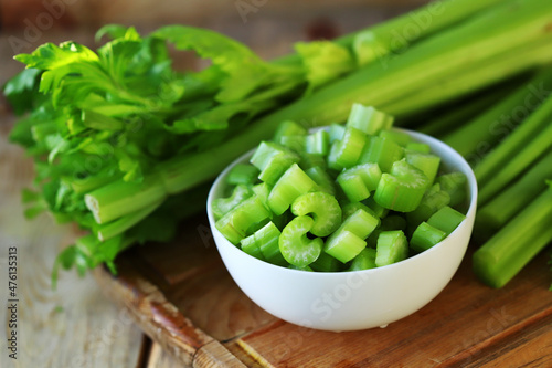 Chopped stalks of fresh celery in a bowl.
