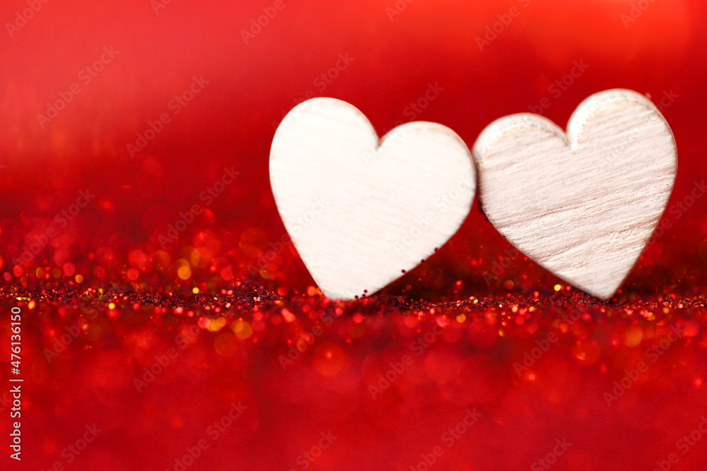 Love concept.Valentine's Day. two white hearts on a red glitter background. Valentines day background in red tones.Love symbol Love concept.Valentine's Day. two white hearts on a red glitter background. Valentines day background in red tones.Love symbol