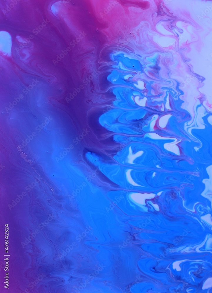 Abstract pink and blue marble background. Acrylic texture with marble pattern. Mixing colors creates an interesting structure. It is well suited for laptop background and wallpaper, fabric