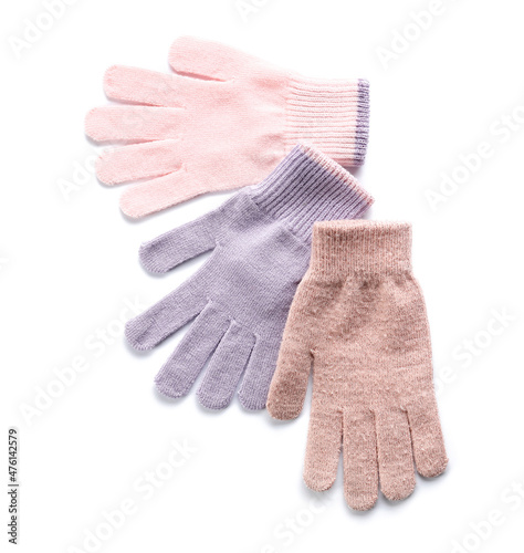 Different warm gloves on white background