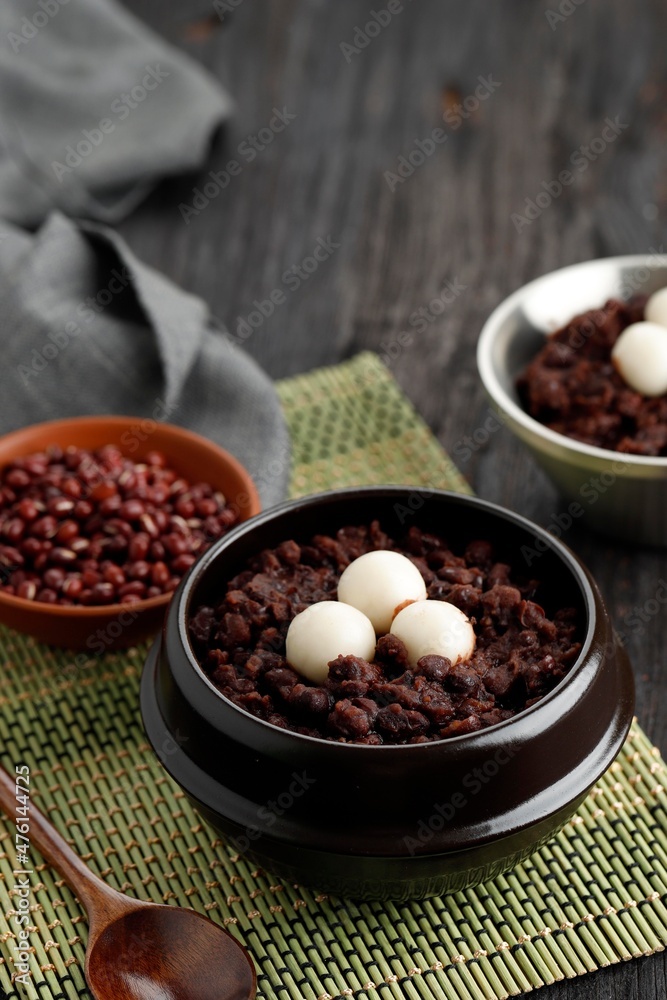 Korean Food Patjuk or Red Bean Porridge Topped with Round Rice Cake, Eat at Winter Solstice Festival Korean Food Patjuk or Red Bean Porridge Topped with Round Rice Cake, Eat at Winter Solstice Festival