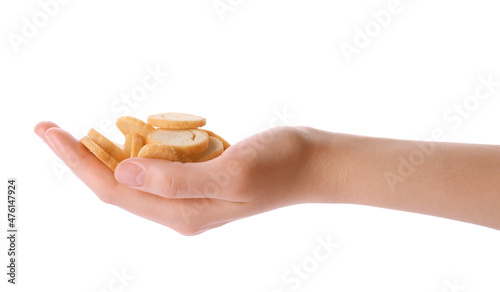 Woman holding crispy rusks on white background, closeup