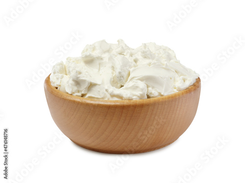 Wooden bowl of tasty cream cheese isolated on white