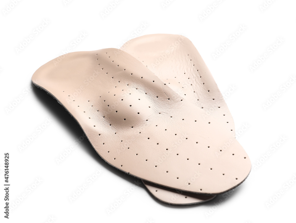 Beige orthopedic insoles on white background Beige orthopedic insoles on white background