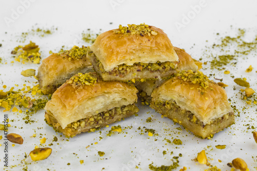 Traditional Turkish Pastry Dessert 
Pistachio Dry Baklava Slices on glass table
