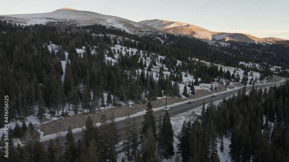 Aerial flight following the traffic of Highway 9 at sunset with Mt. Silverheels in the background. Filmed in the Rocky Mountains of Colorado at Hoosier pass between Dillon and Alma. Aerial flight following the traffic of Highway 9 at sunset with Mt. Silverheels in the background. Filmed in the Rocky Mountains of Colorado at Hoosier pass between Dillon and Alma.