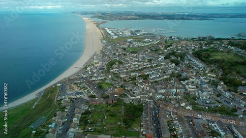 Aerial view over Isle of Portland, Chesil Beach and Fleet Lagoon towards Weymouth on the horizon. photo