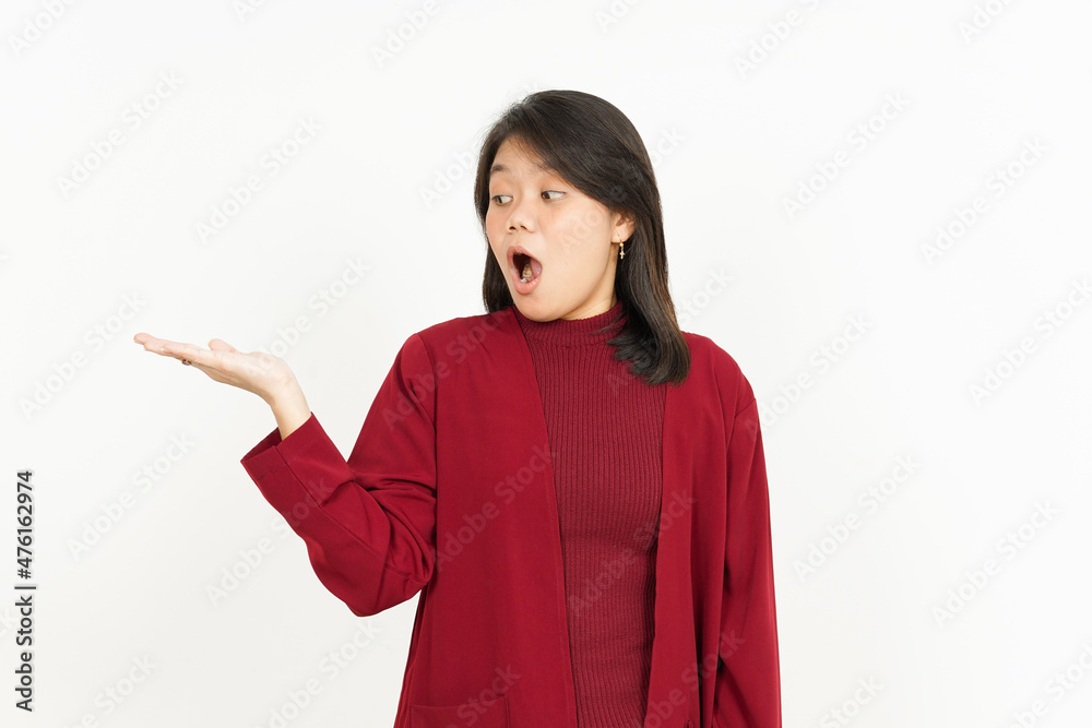 Showing recommended product on open palm Of Beautiful Asian Woman Wearing Red Shirt Isolated On White Background Showing recommended product on open palm Of Beautiful Asian Woman Wearing Red Shirt Isolated On White Background