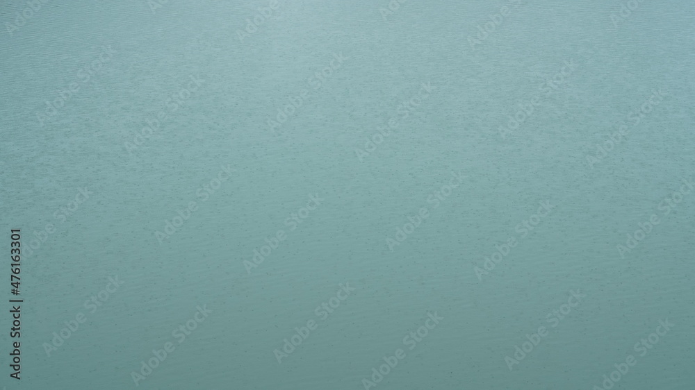 The green river surface look in the windy and rainy day in spring The green river surface look in the windy and rainy day in spring