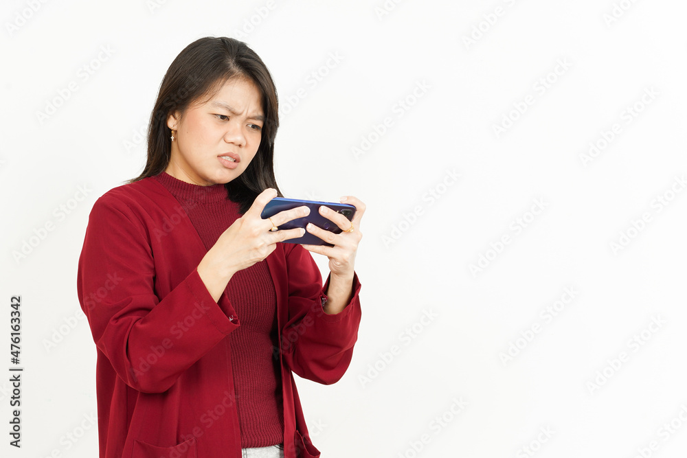 Playing Mobile Game on Smartphone Of Beautiful Asian Woman Wearing Red Shirt Isolated On White Playing Mobile Game on Smartphone Of Beautiful Asian Woman Wearing Red Shirt Isolated On White