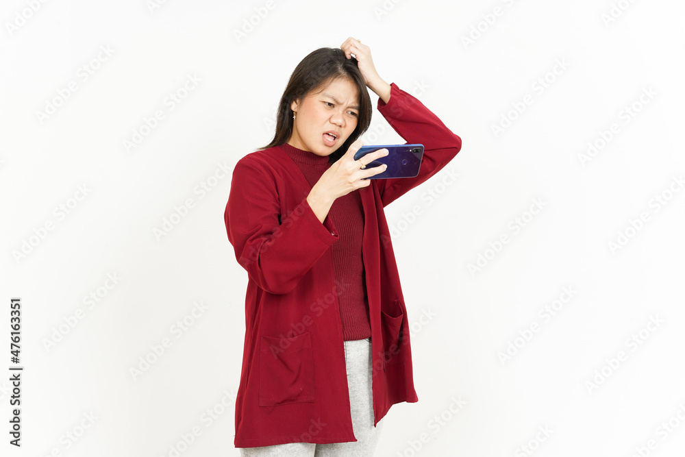 Playing Mobile Game on Smartphone Of Beautiful Asian Woman Wearing Red Shirt Isolated On White Playing Mobile Game on Smartphone Of Beautiful Asian Woman Wearing Red Shirt Isolated On White